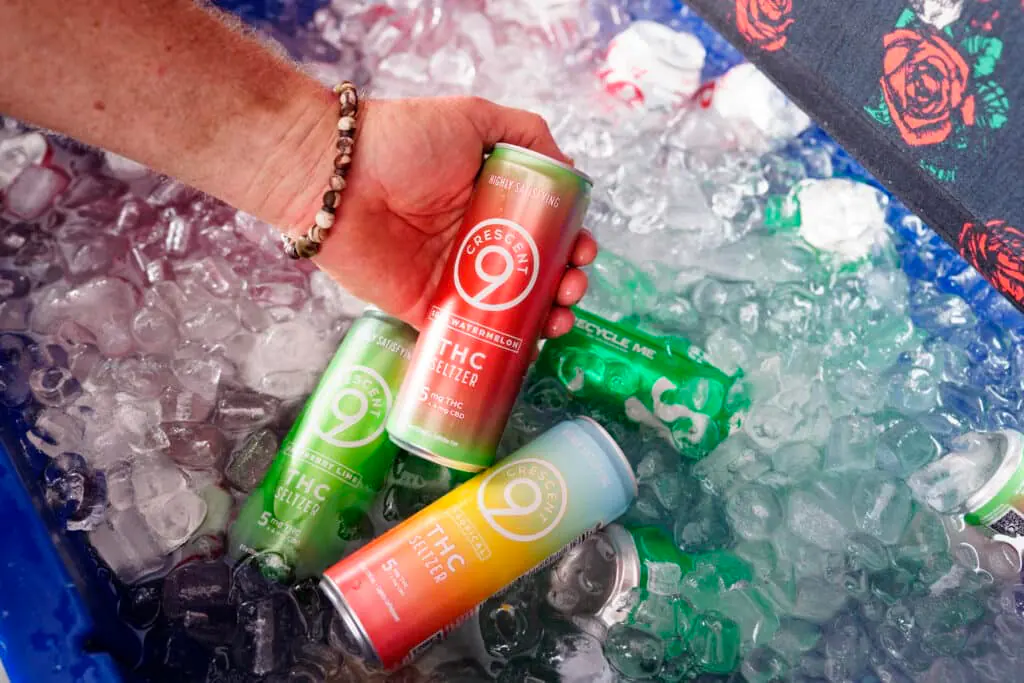 Crescent 9 THC seltzer cans on ice