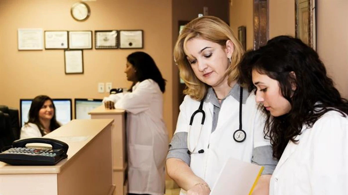 A patient discussing medical access with a physician